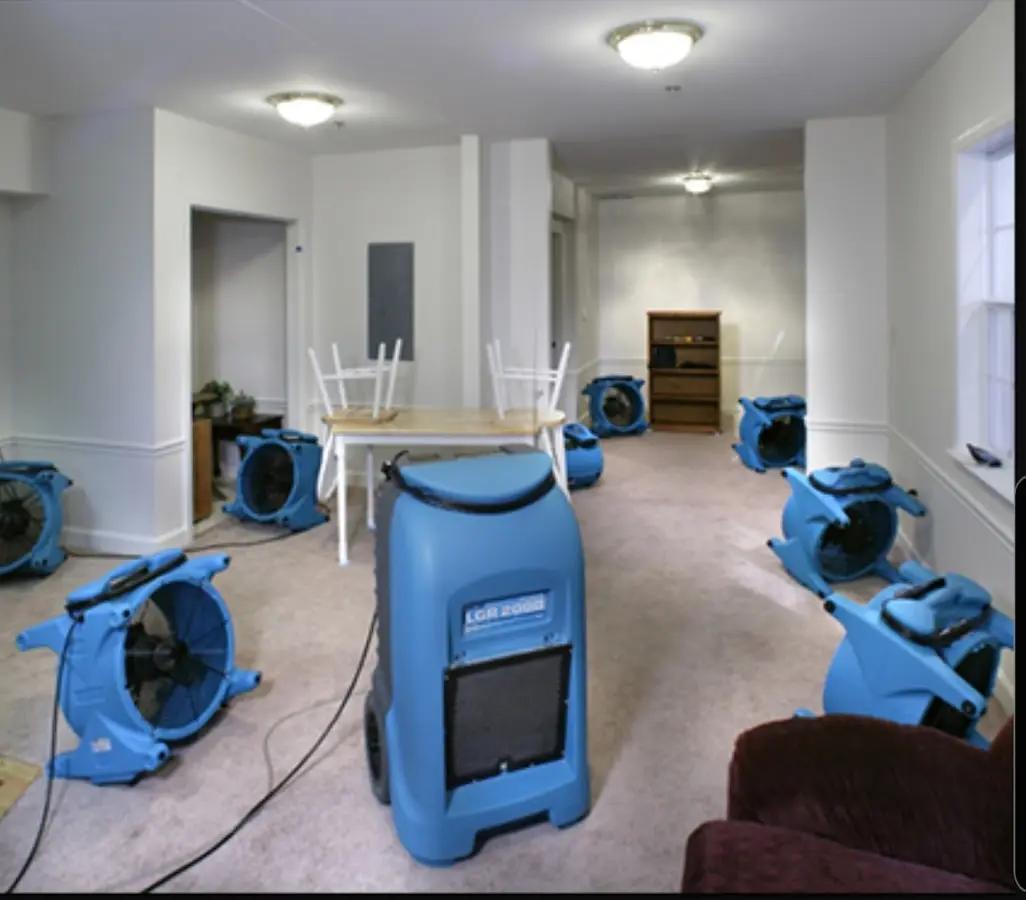 Air movers and dehumidifier setup for Water Damage Restoration in Glenville